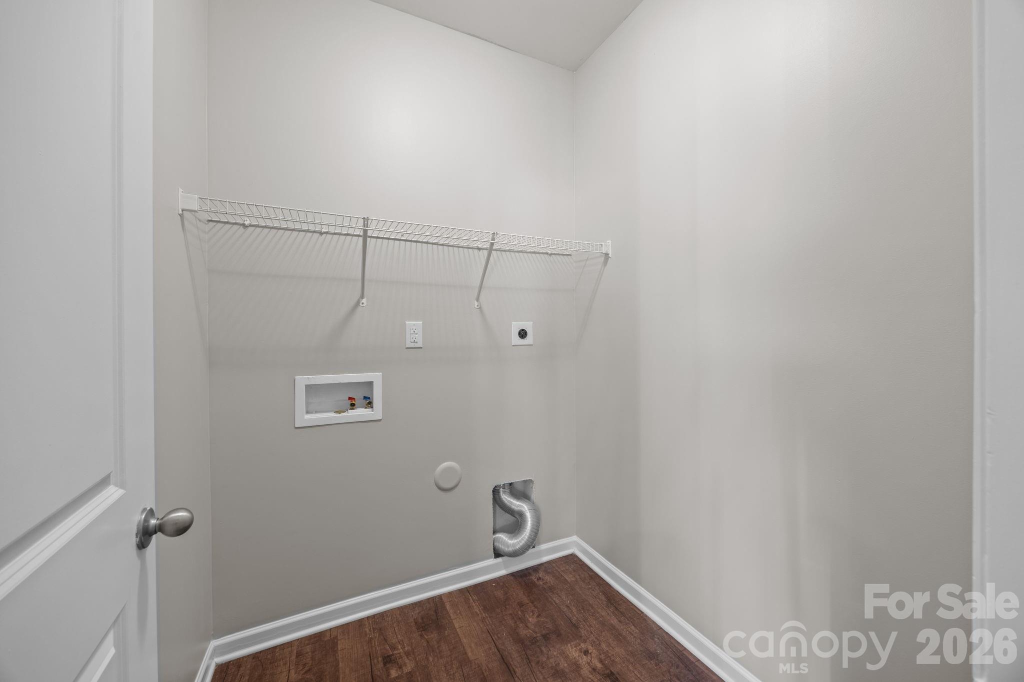 116 Rippling Water Drive Mount Holly, NC 28120 - Photo 22 of 48 a view of a room with racks on the wall