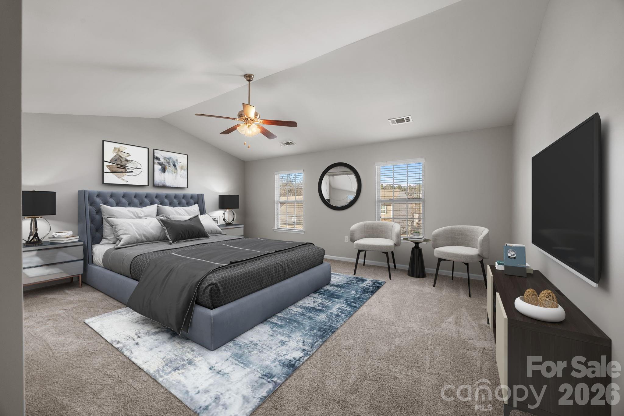 116 Rippling Water Drive Mount Holly, NC 28120 - Photo 24 of 48 a bedroom with a bed and a flat screen tv