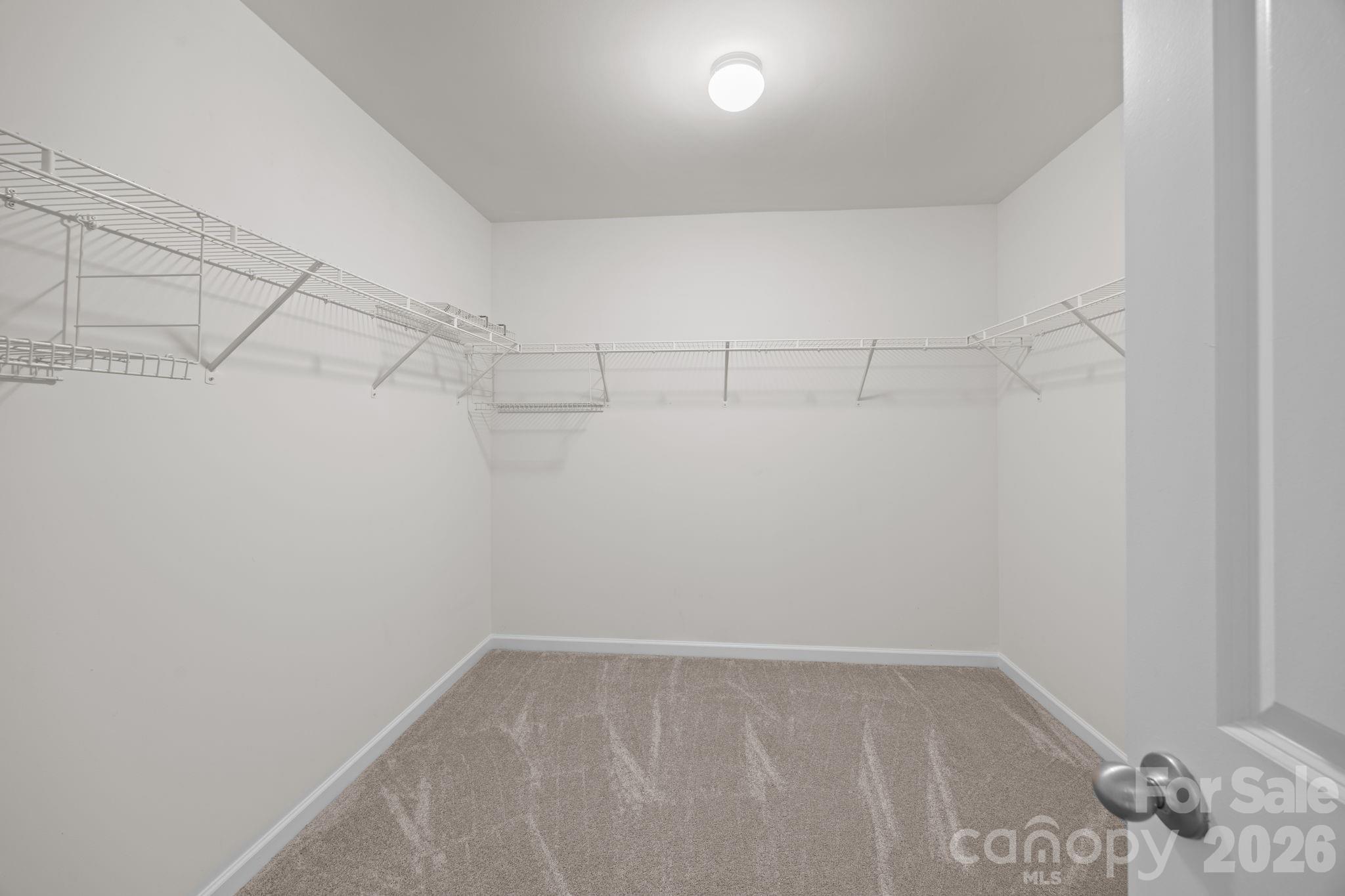 116 Rippling Water Drive Mount Holly, NC 28120 - Photo 29 of 48 a view of a room with racks on the wall