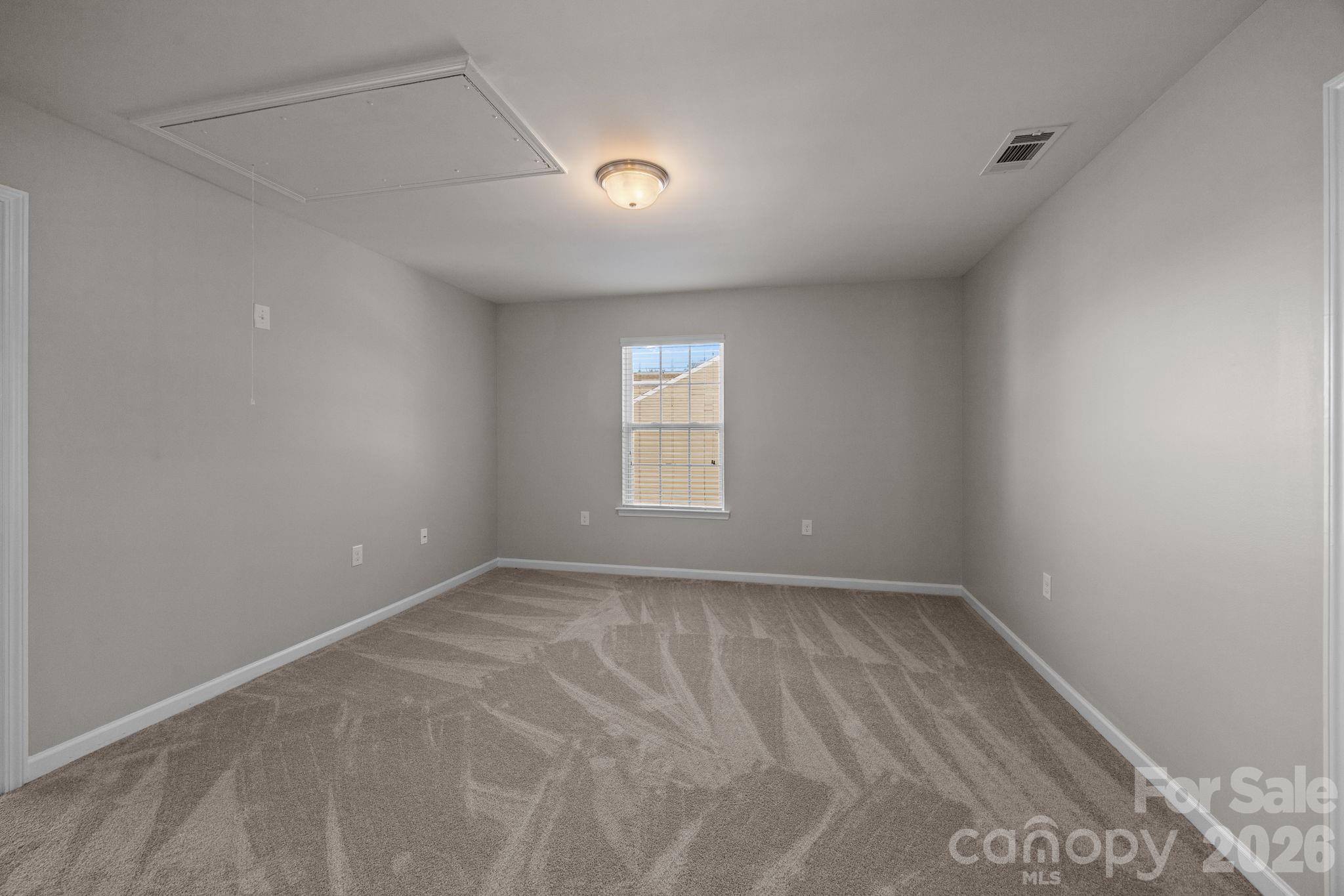 116 Rippling Water Drive Mount Holly, NC 28120 - Photo 30 of 48 a view of an empty room with a window