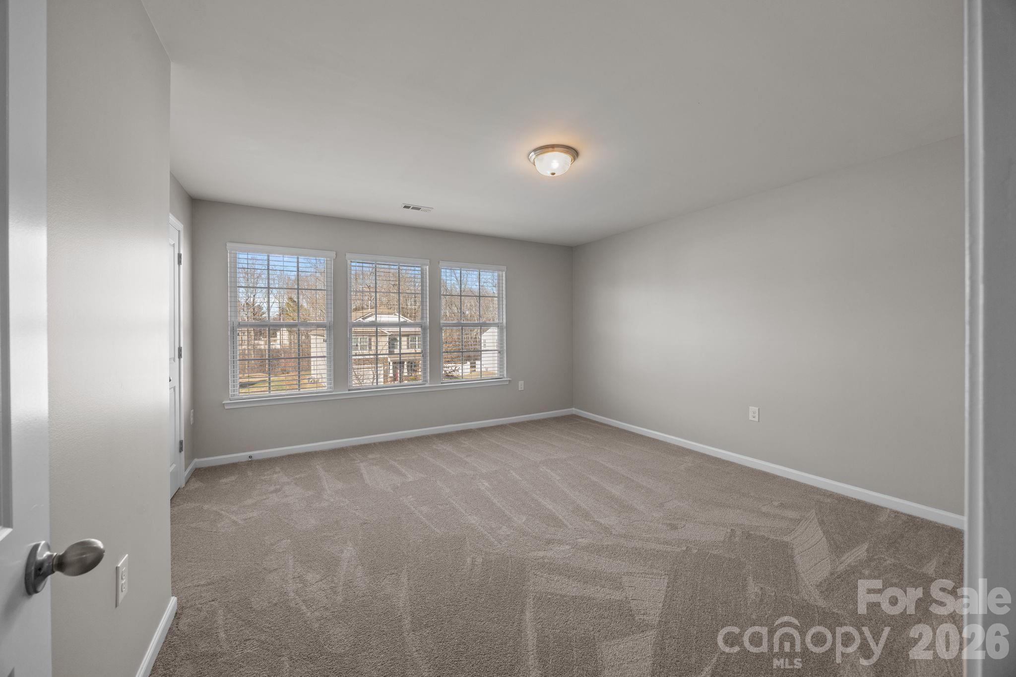 116 Rippling Water Drive Mount Holly, NC 28120 - Photo 31 of 48 a view of an empty room with a window