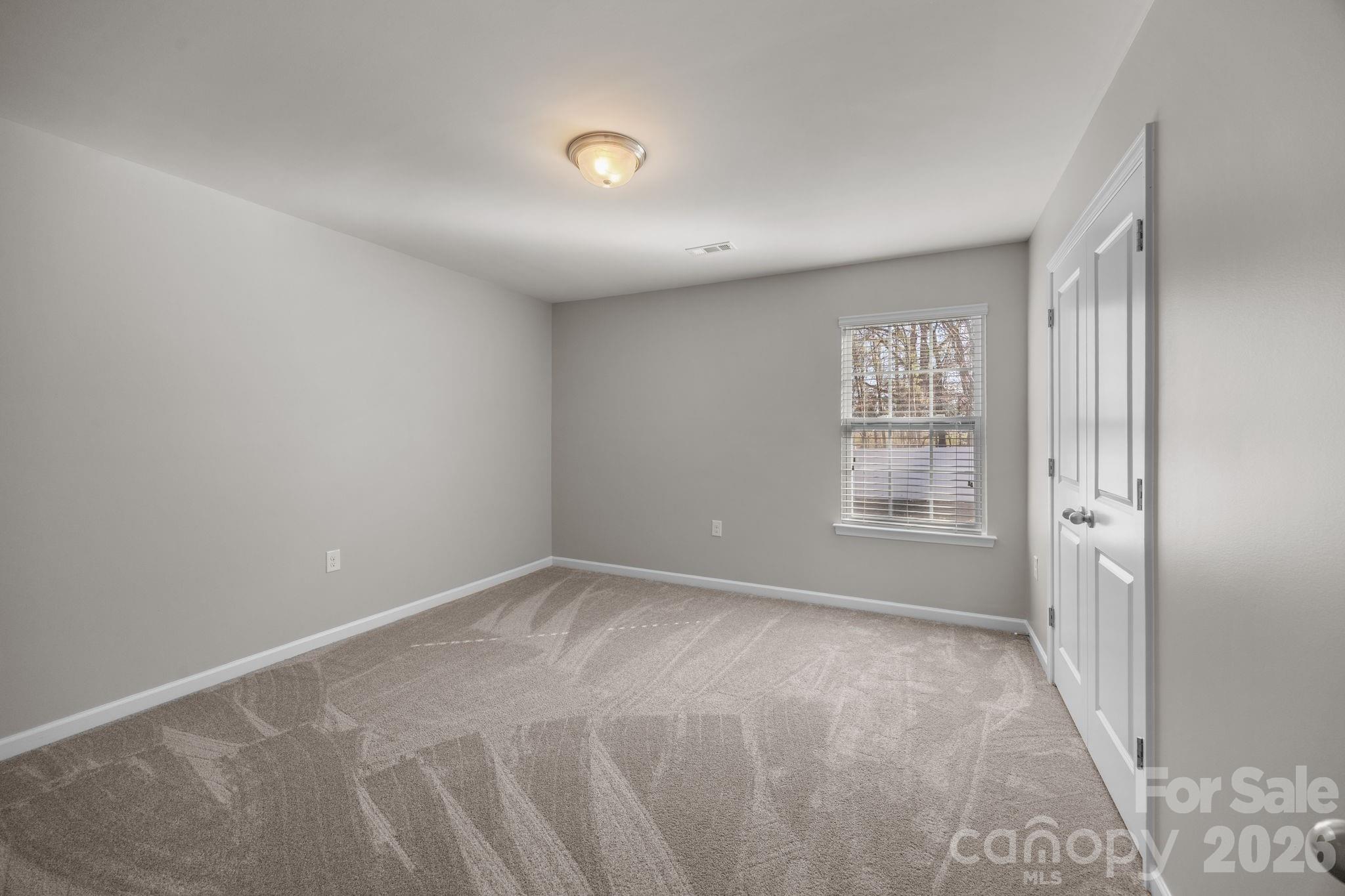 116 Rippling Water Drive Mount Holly, NC 28120 - Photo 35 of 48 a view of an empty room with a window