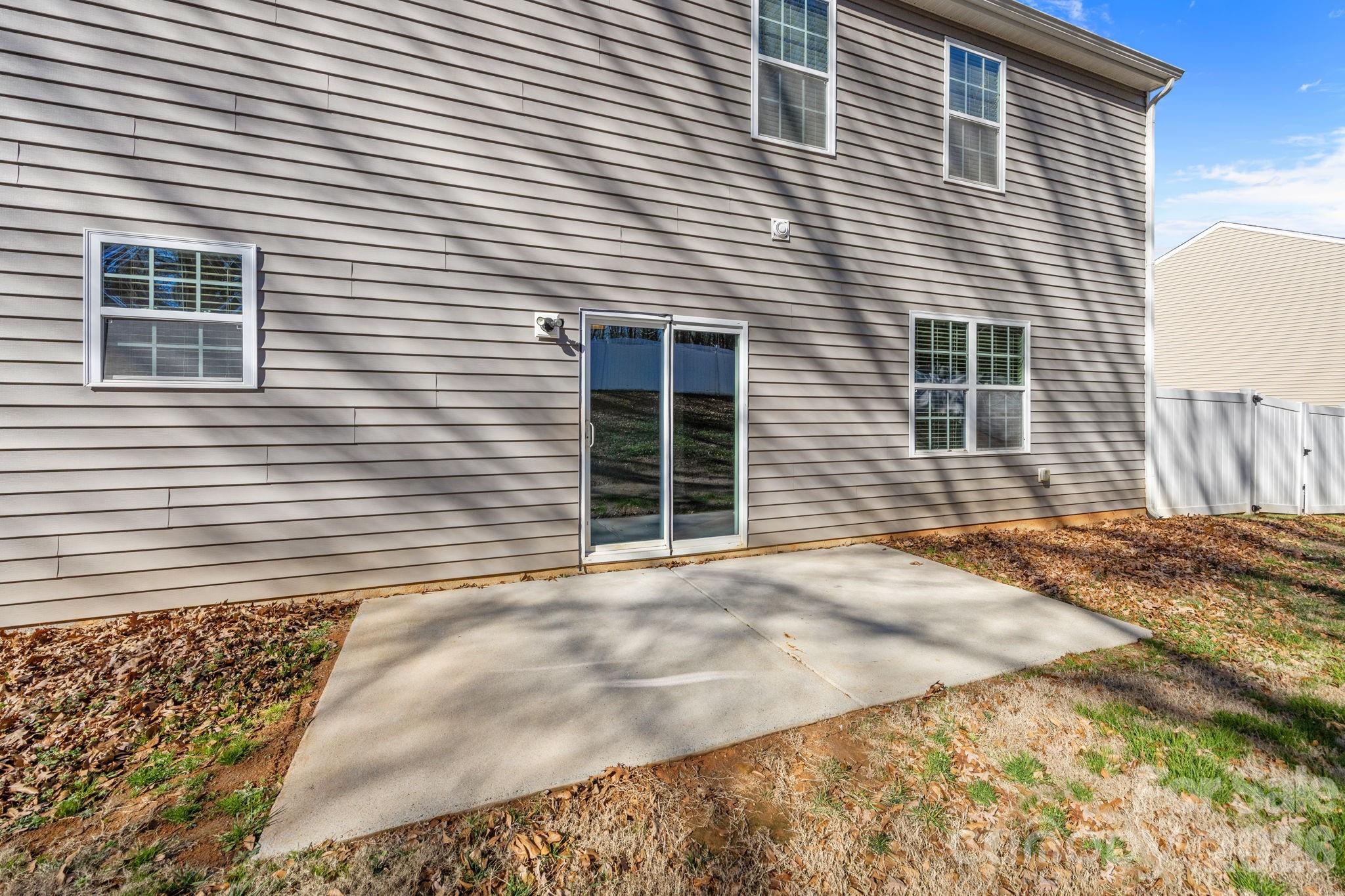 116 Rippling Water Drive Mount Holly, NC 28120 - Photo 38 of 48 a view of a house with a patio