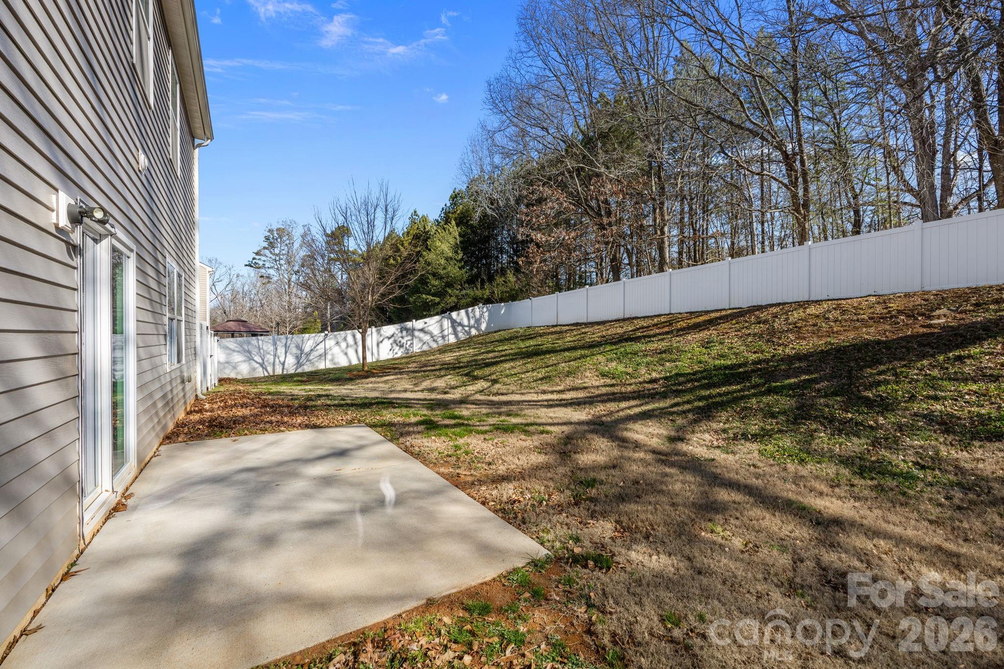116 Rippling Water Drive Mount Holly, NC 28120 - Photo 39 of 48 a view of a yard with wooden fence