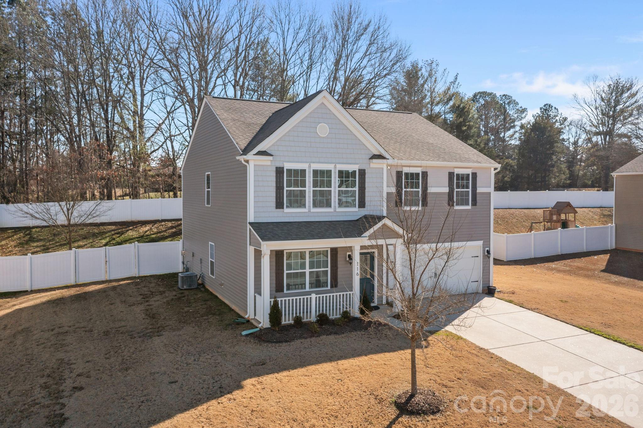 116 Rippling Water Drive Mount Holly, NC 28120 - Photo 47 of 48 a front view of a house with a yard