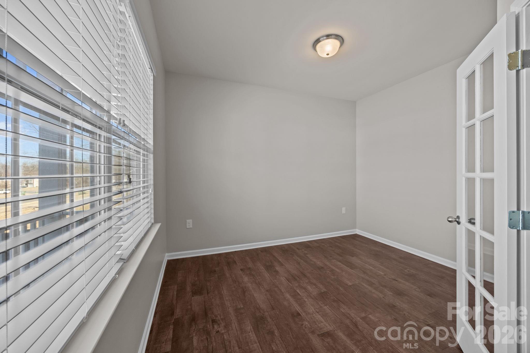 116 Rippling Water Drive Mount Holly, NC 28120 - Photo 5 of 48 a view of a room with wooden floor and windows