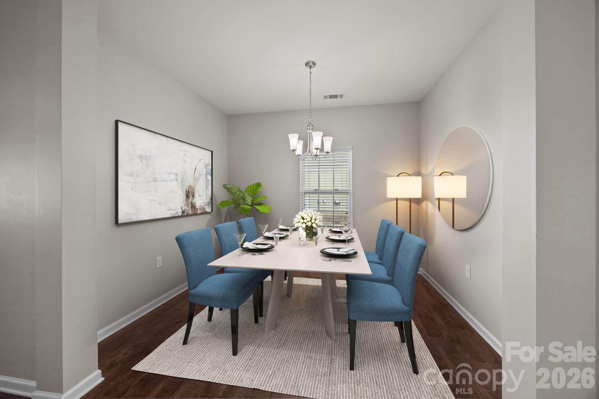 116 Rippling Water Drive Mount Holly, NC 28120 - Photo 10 of 48 a view of a dining room with furniture and a chandelier