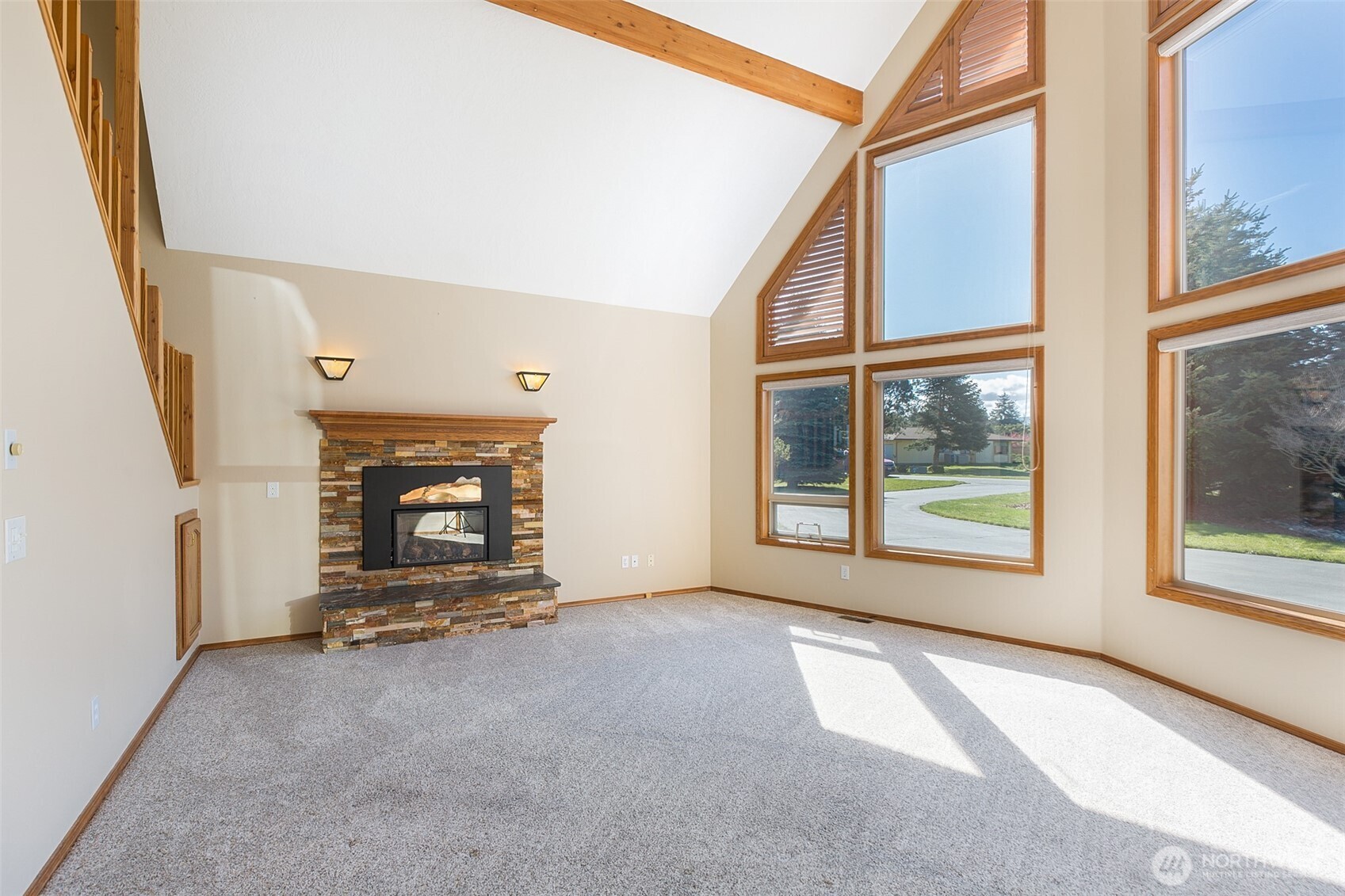 81 Bon Jon View Way Sequim, WA 98382 - Photo 14 of 38 a view of an empty room with a fireplace and a window