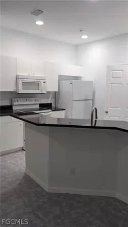 a view of a kitchen with a sink