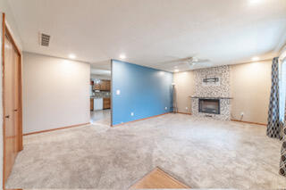 601 Post Street Wanatah, IN 46390 - Photo 11 of 37 a view of an empty room with a fireplace