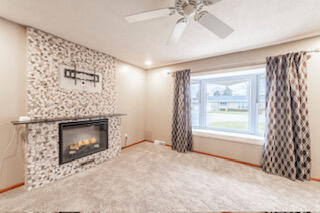 601 Post Street Wanatah, IN 46390 - Photo 15 of 37 a view of an empty room with a fireplace and a window