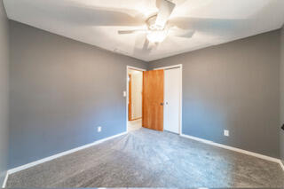 601 Post Street Wanatah, IN 46390 - Photo 17 of 37 a view of an empty room with a chandelier fan