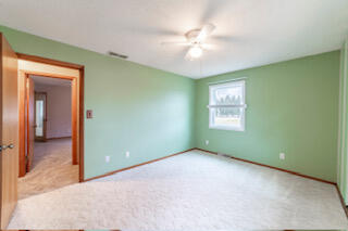 601 Post Street Wanatah, IN 46390 - Photo 22 of 37 wooden floor in an empty room with a window
