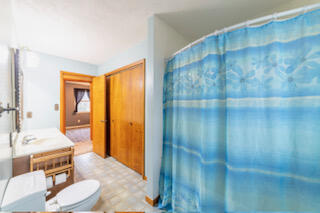601 Post Street Wanatah, IN 46390 - Photo 23 of 37 a spacious bathroom with a granite countertop sink a toilet and shower
