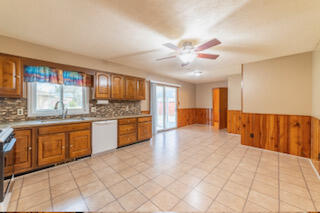 601 Post Street Wanatah, IN 46390 - Photo 24 of 37 a large kitchen with stainless steel appliances granite countertop a stove a sink and a refrigerator