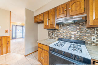 601 Post Street Wanatah, IN 46390 - Photo 26 of 37 a kitchen with a stove and a cabinets