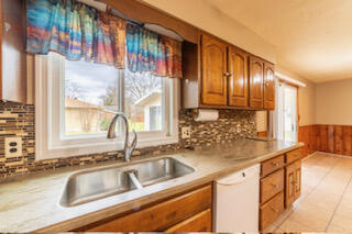 601 Post Street Wanatah, IN 46390 - Photo 27 of 37 a kitchen with stainless steel appliances granite countertop a sink a counter space and cabinets