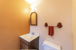 601 Post Street Wanatah, IN 46390 - Photo 30 of 37 a bathroom with a sink a mirror and vanity