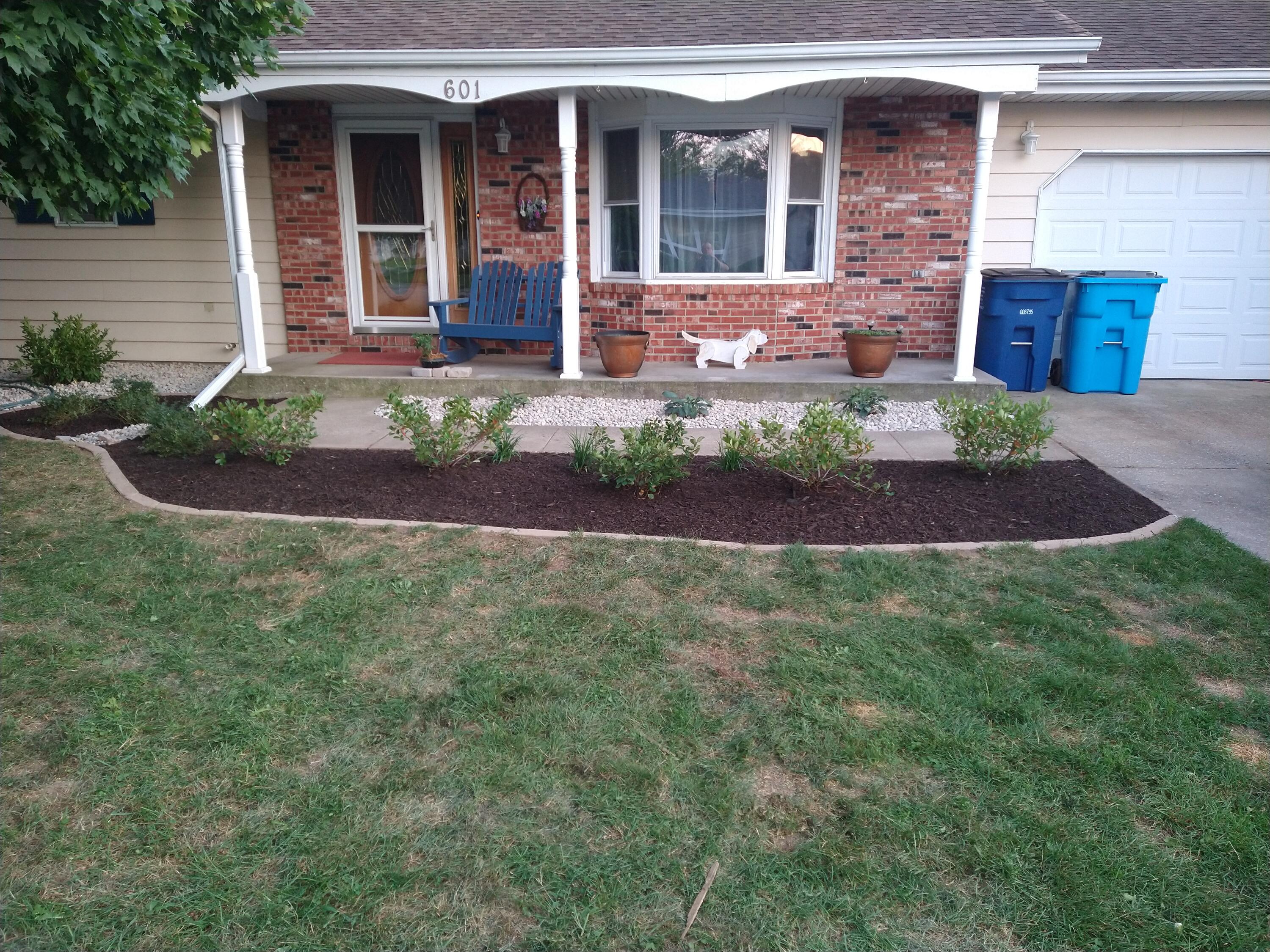601 Post Street Wanatah, IN 46390 - Photo 36 of 37 a front view of a house with garden