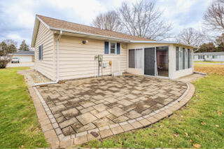 601 Post Street Wanatah, IN 46390 - Photo 6 of 37 a backyard of a house with large trees and barbeque oven