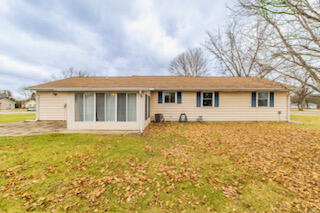 601 Post Street Wanatah, IN 46390 - Photo 8 of 37 a front view of a house with swimming pool