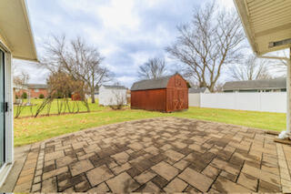 601 Post Street Wanatah, IN 46390 - Photo 10 of 37 a view of a yard with yellow house
