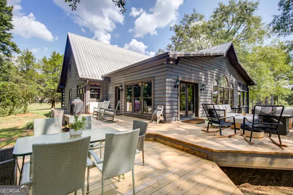 a spacious bedroom with a large bed and a large window