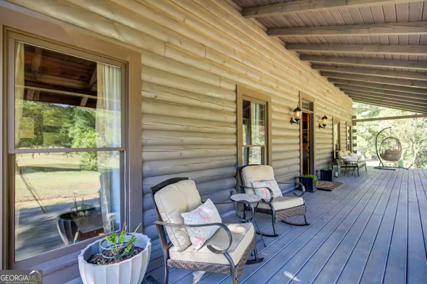 a dining room with furniture wooden floor and a rug