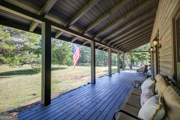 a living room with furniture a fireplace and a table