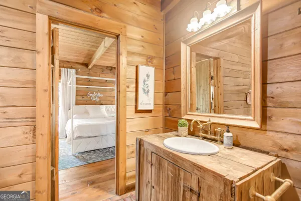 a living room with furniture a fireplace and a large window