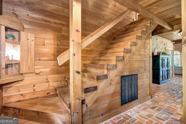 a bathroom with a sink a mirror and a shower