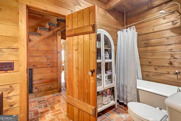 a view of a swimming pool and trees in the background