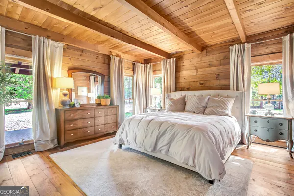 a view of a house with a yard and tree s