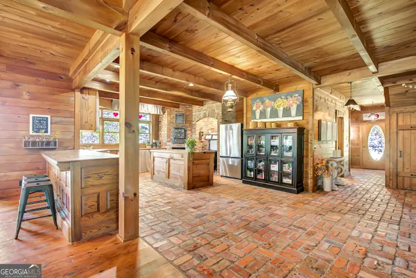 an aerial view of a house with a yard and swimming pool