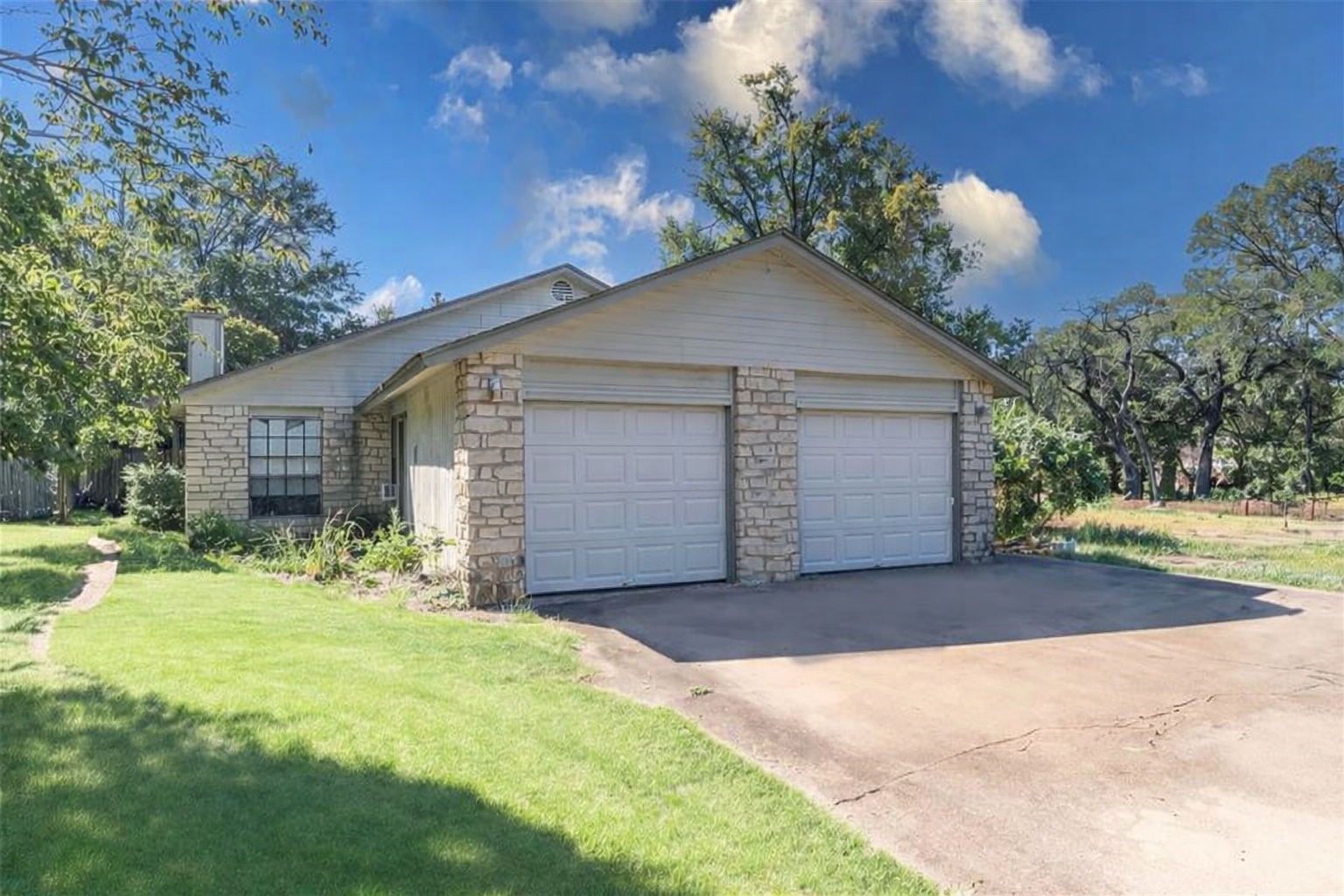 12003 Commonwealth Way Austin, TX 78759 - Photo 1 of 5 a front view of a house with a yard and garage