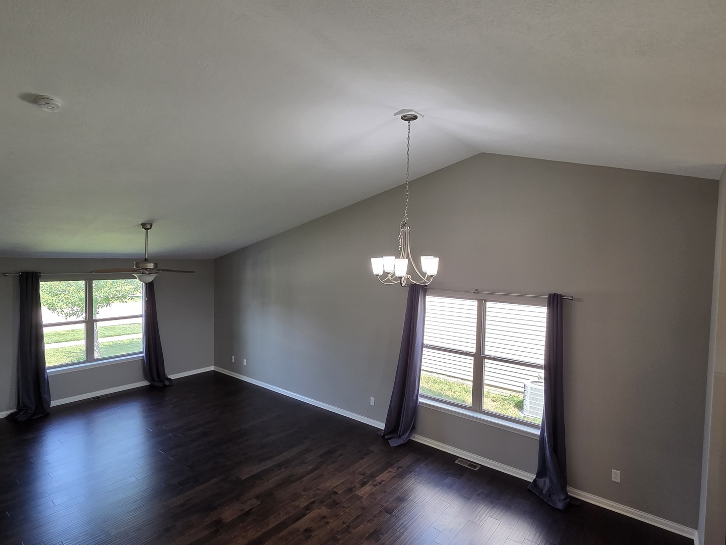 1036 Stags Leap Road Normal, IL 61761 - Photo 12 of 43 an empty room with wooden floor and windows