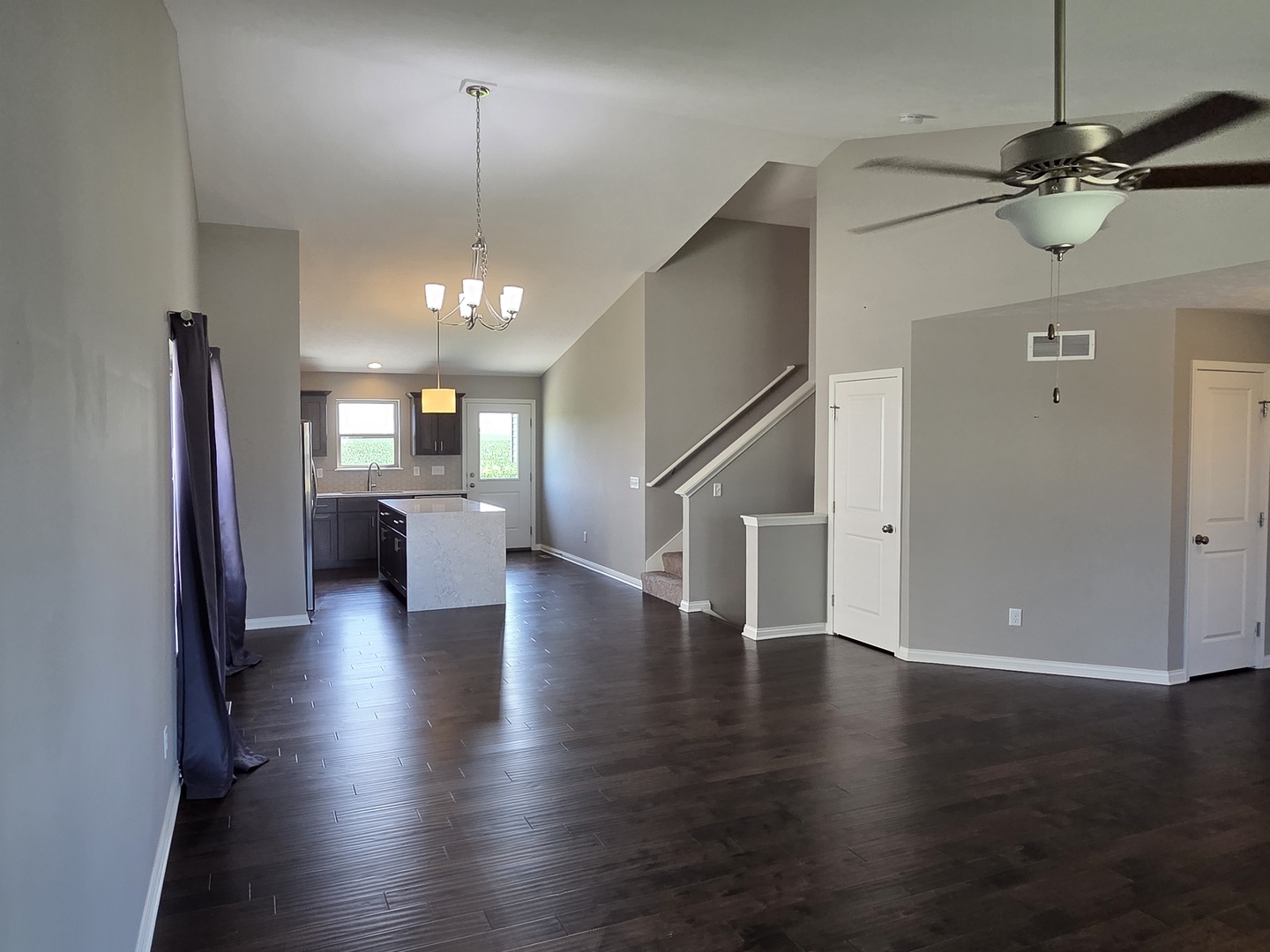 1036 Stags Leap Road Normal, IL 61761 - Photo 14 of 43 wooden floor in an empty room with a mirror