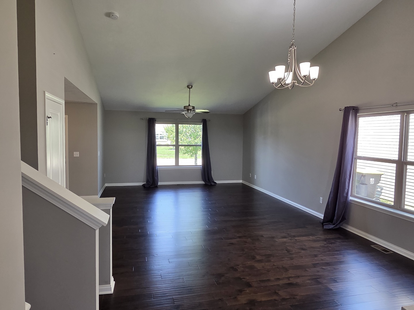 1036 Stags Leap Road Normal, IL 61761 - Photo 15 of 43 an empty room with wooden floor and windows