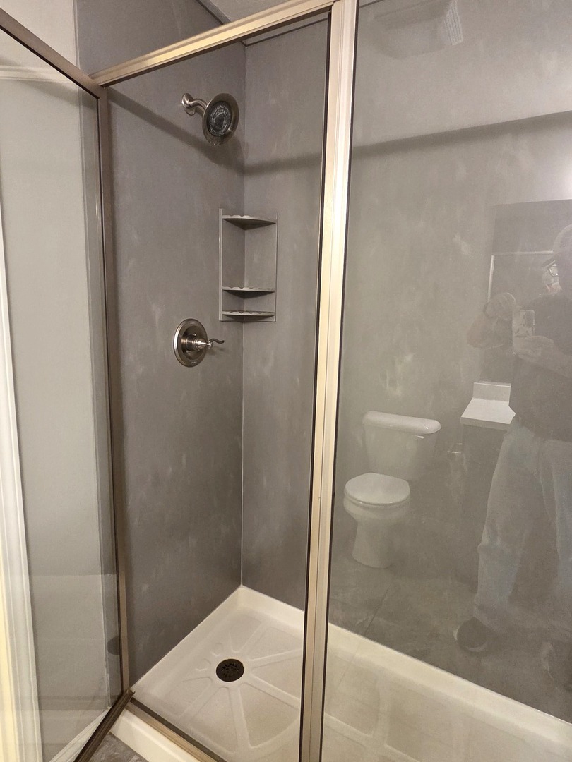 1036 Stags Leap Road Normal, IL 61761 - Photo 20 of 43 a bathroom with a glass shower door