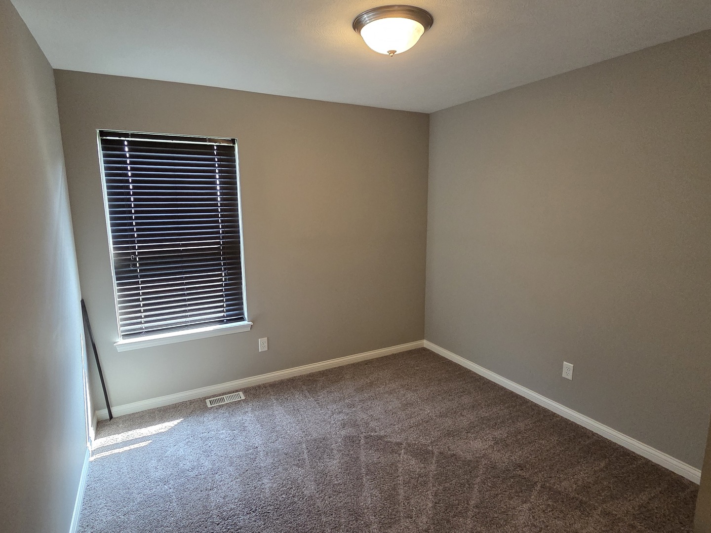 1036 Stags Leap Road Normal, IL 61761 - Photo 22 of 43 a view of an empty room with a window