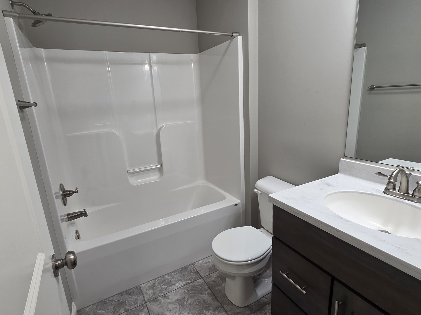 1036 Stags Leap Road Normal, IL 61761 - Photo 26 of 43 a bathroom with a sink a toilet and a bathtub