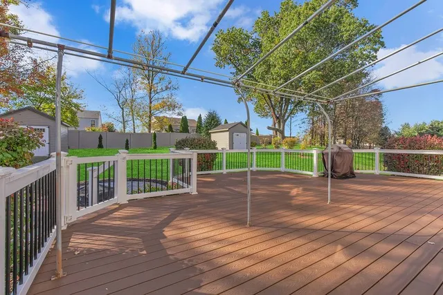 a view of backyard with seating space and trees
