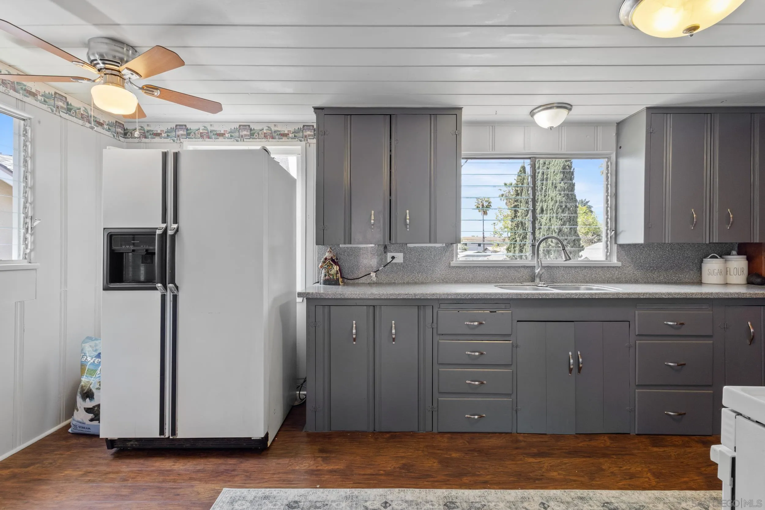 304 Palm Drive Vista, CA 92084 - Photo 14 of 32 a bathroom with a granite countertop sink a mirror and a shower