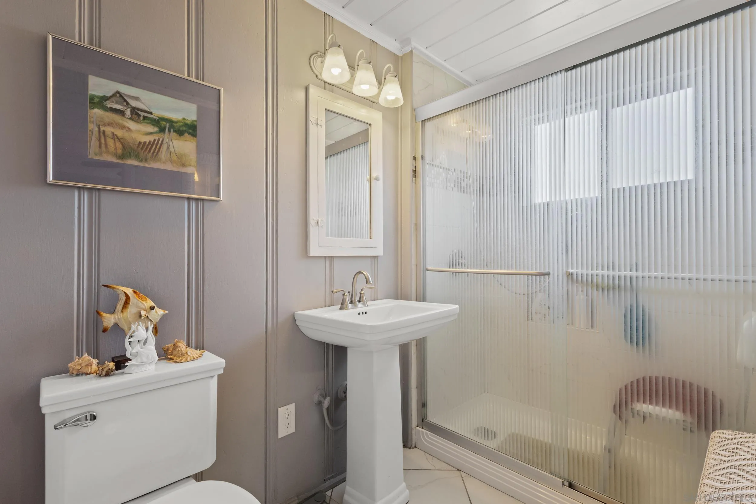 304 Palm Drive Vista, CA 92084 - Photo 17 of 32 a bathroom with a sink mirror toilet and bathtub