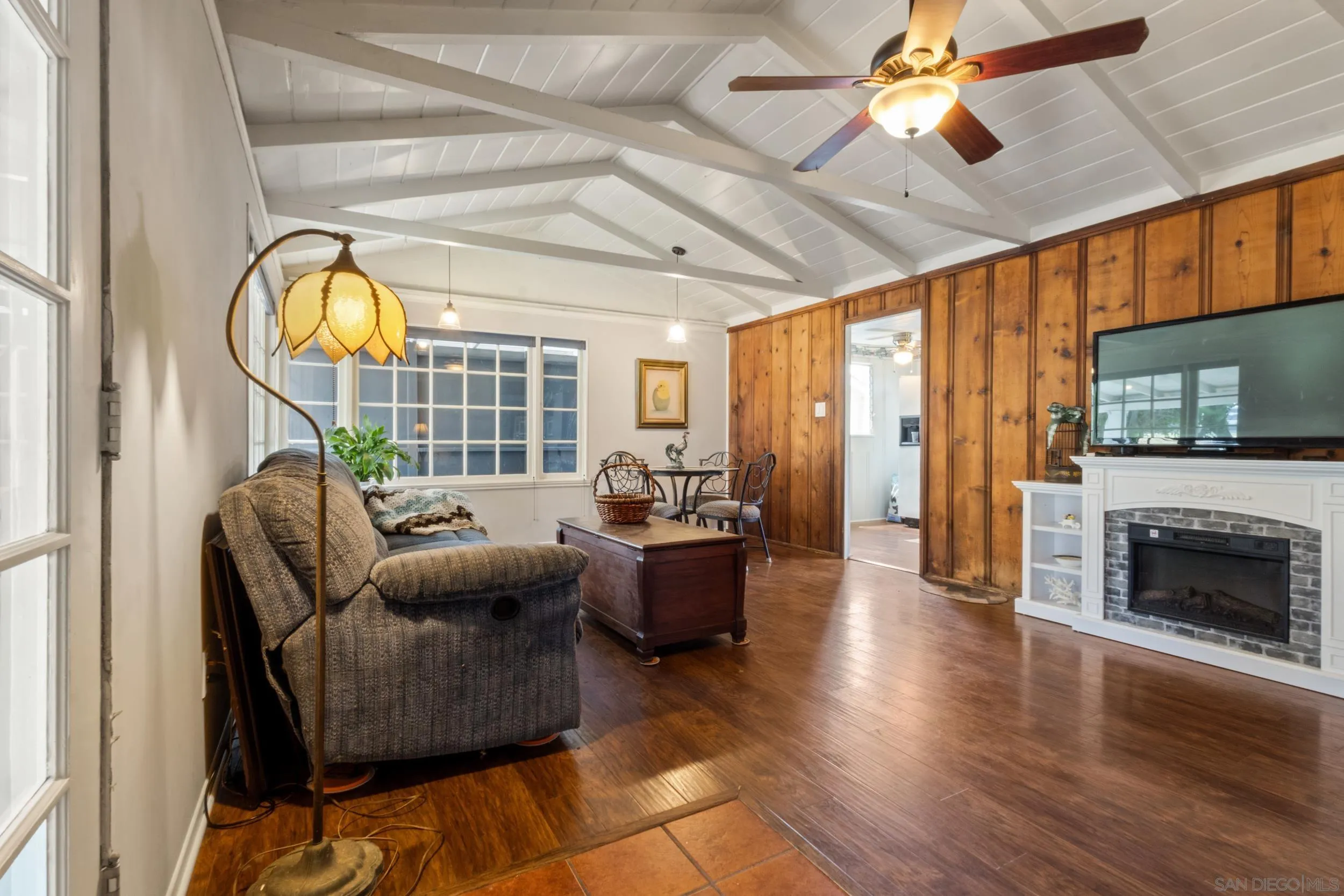 304 Palm Drive Vista, CA 92084 - Photo 3 of 32 a living room with furniture a fireplace and a flat screen tv