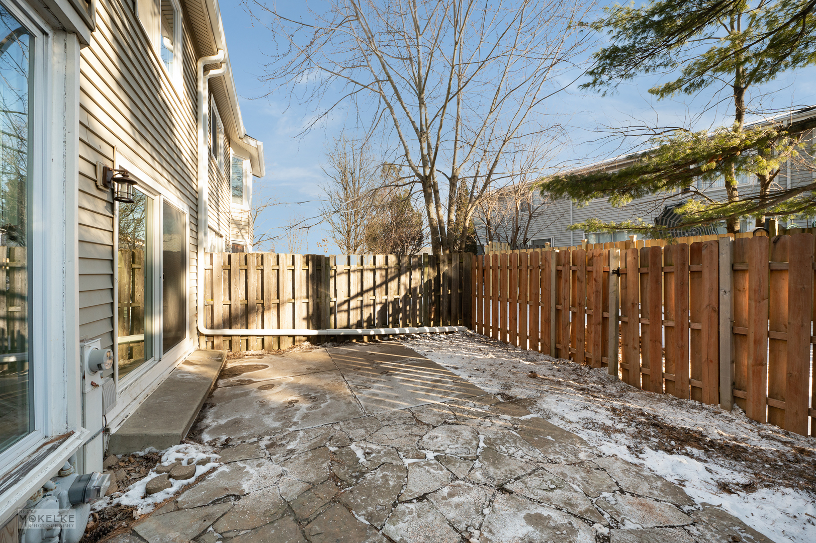 193 Jeffrey Lane Bolingbrook, IL 60440 - Photo 26 of 27 a view of a backyard with large trees and wooden fence