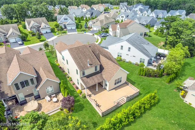 an aerial view of a house with a garden