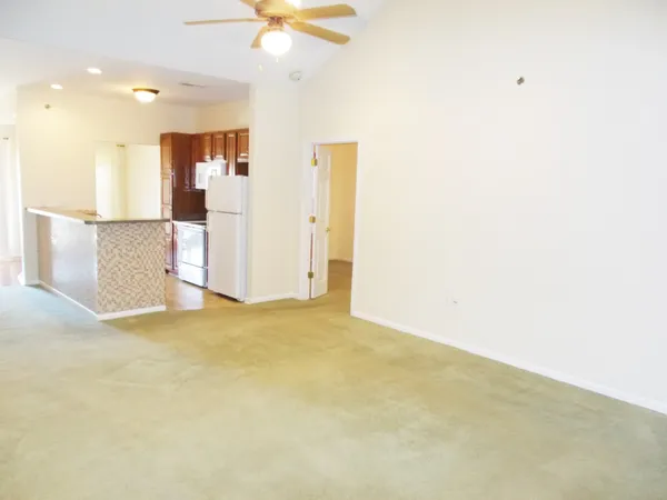 a view of empty room with a ceiling fan
