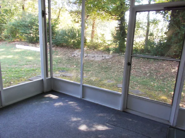 a view of a room with yard from a window