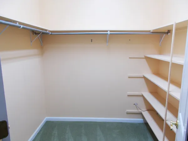 a view of an empty walk in closet